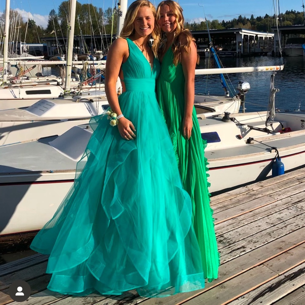teal dress on the left! Only worn once in beautiful condition. Prom/homecoming